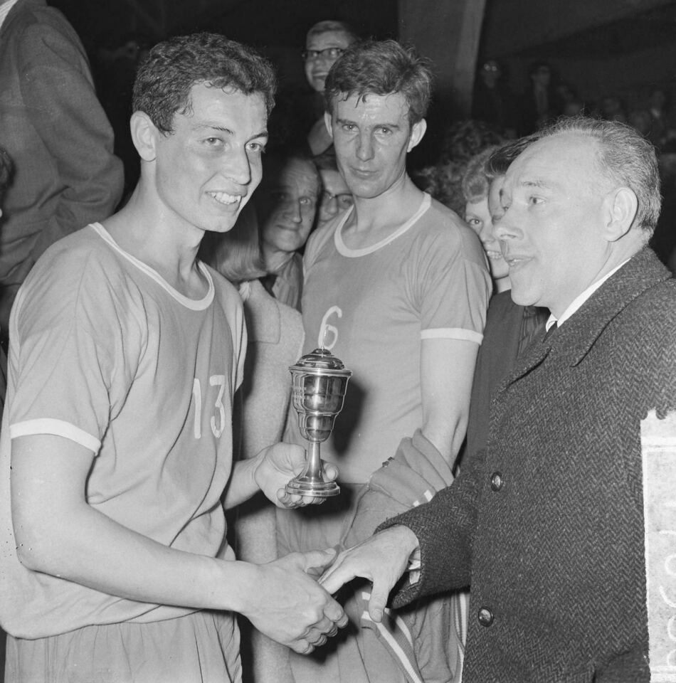 The Wolves captain Ton Boot with the championship trophy, the chairman on the right, 10 April 1965